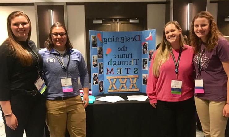 SAU Iota Omega leaders present at conference